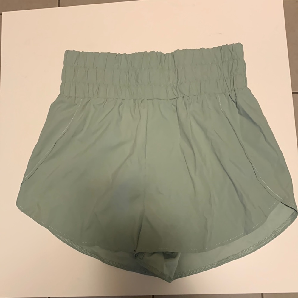 High waisted sage green running shorts